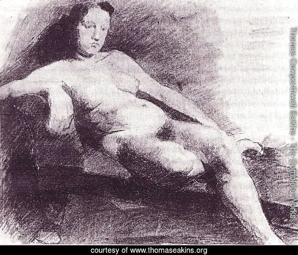 Nude woman reclining on a couch